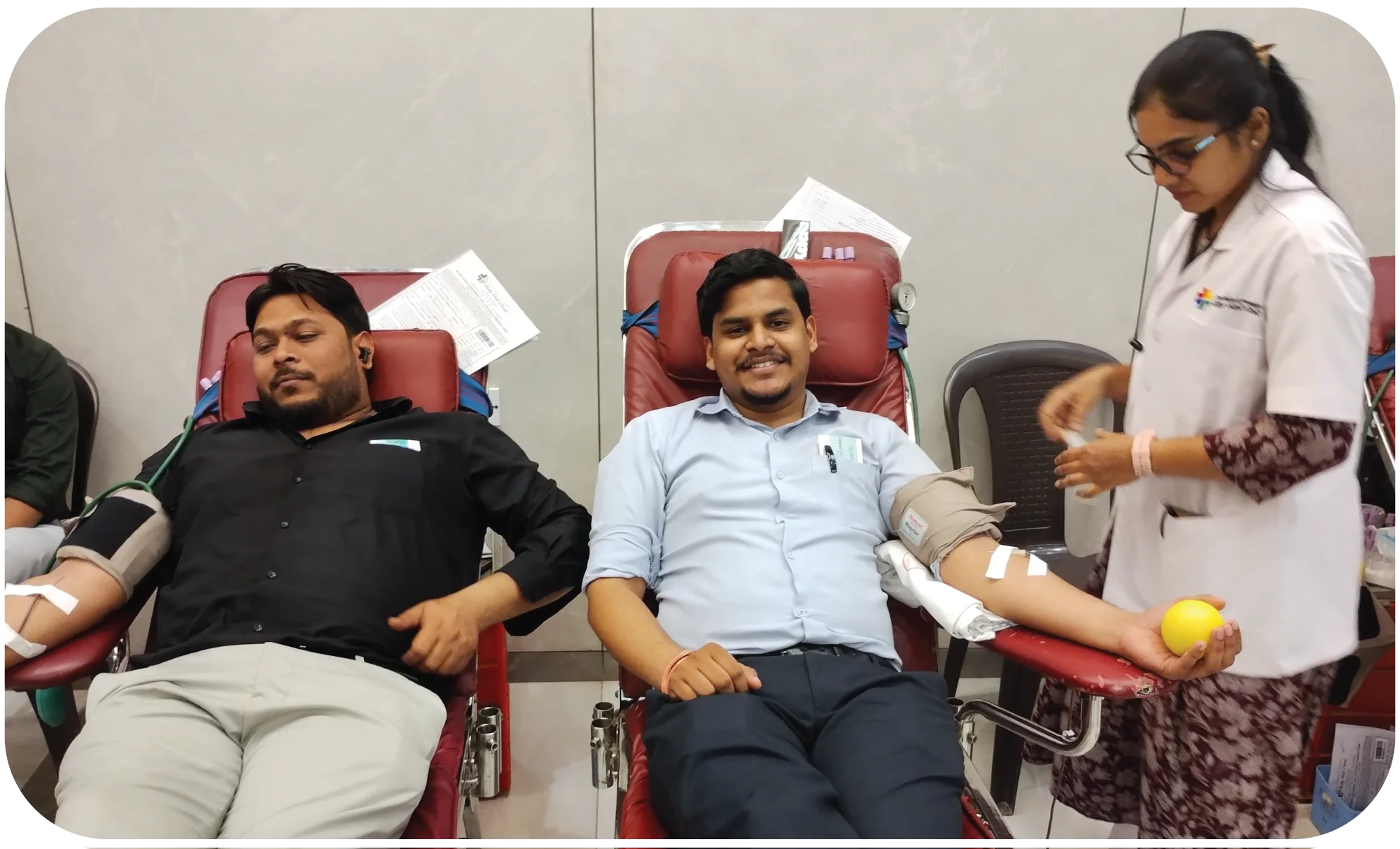 Volunteer registering donor details at a blood donation desk